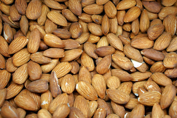 Background of big raw peeled almonds