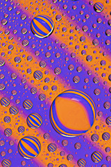 Water droplets on diagonal stripes