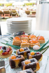 Candy bar food buffet by the pool, during hotel brunch, catering in the garden, food bloggers event