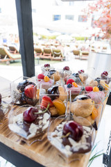 Candy bar food buffet by the pool, during hotel brunch, catering in the garden, food bloggers event