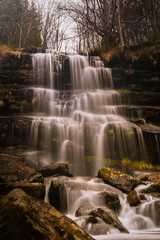 Waterfall in a forest on mountain. Called Tupavica waterfall on old mountain (stara planina) near the village Dojkinci in Serbia