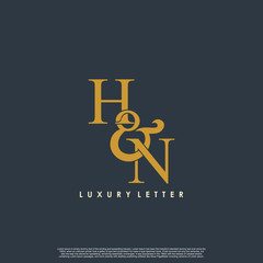 Initial letter H & N HN luxury art vector mark logo, gold color on black background.