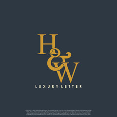Initial letter H & W HW luxury art vector mark logo, gold color on black background.