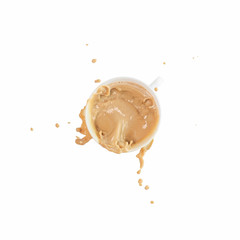 Coffee splash from a cup isolated on white background, top view