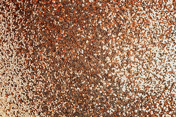 Golden sparkles close up. Bright festive background for sites and layouts