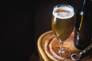 Glass beer on dark background with copy space