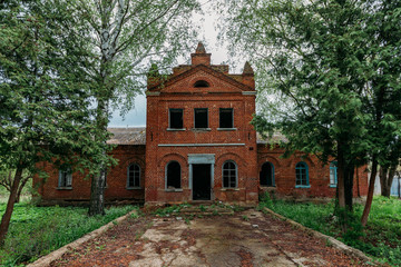 Fototapeta premium Old abandoned red brick mansion. Former Bikovo manor, Lipetsk region