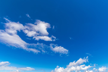 Naklejka na ściany i meble white fluffy clouds on the blue sky. beautiful nature background