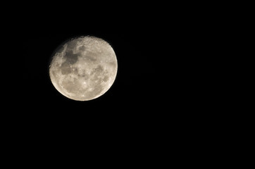 Beautiful photo of the full moon in close up with dark sky in the background.