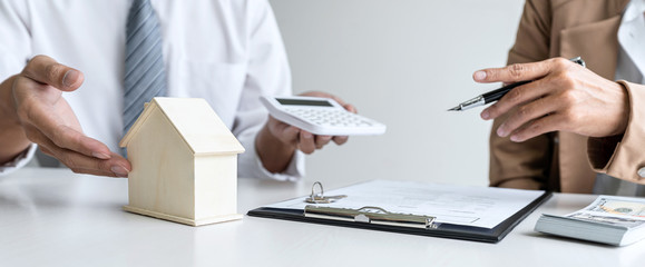 Real estate broker agent talk reach contract form presenting and consult to customer to decision...