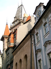 Fototapeta na wymiar Prague typical street multistylistic architecture. Facades and roof angles crossing