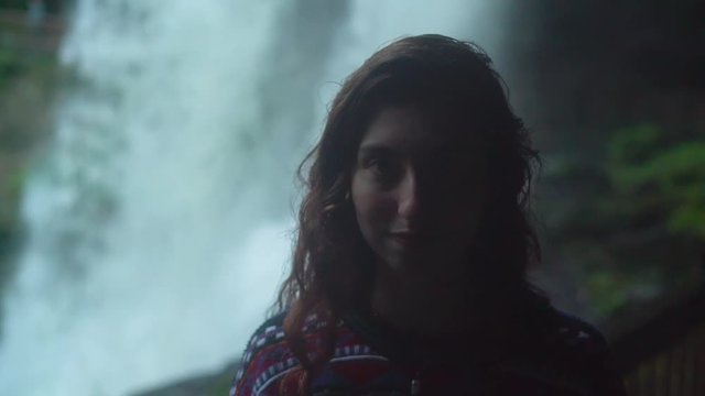 Girl Looking Around Big Dreamy Waterfall