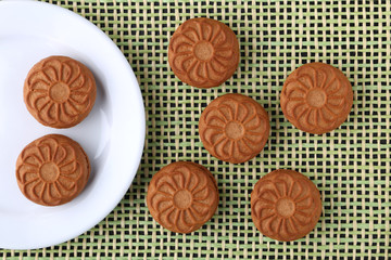 cookie close-up on a plate on a table. vertical view from above