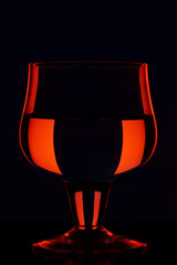 A glass of wine with a good reflection