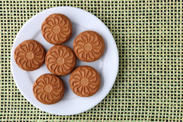 cookie close-up on a plate on a table. vertical view from above