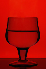 A glass of wine with a good reflection