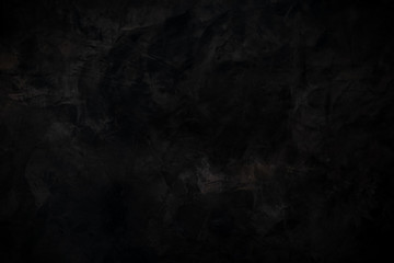 Textured black painted wall with brush strokes