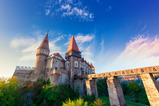 famouse corvins castle in hunedoara at sunrise. one of the largest in europe and is in a list of seven wonders of romania. fantastic morning scenery