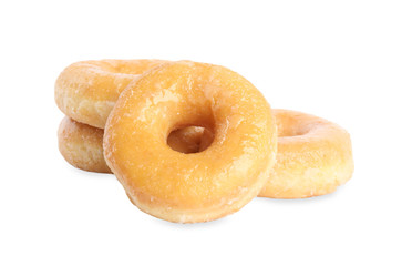 Sweet delicious glazed donuts on white background