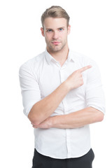 Look there. Man handsome smiling unshaven guy on white background pointing finger. Advertising concept. Advertising agency. Friendly receptionist. Advertising goods. Man pointing direction