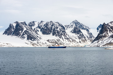 Obraz premium Expedition ship in Arctic sea, Svalbard. Passenger cruise vessel. Arctic and Antarctic cruise.