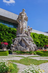 Fototapeta premium Statue at the Mirabell gardens by beautiful summer day, Salzburg, Austria