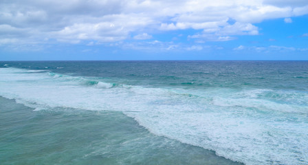Cloudy with seascape and beach in tropical. Ocean with a wave.