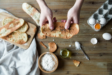 Thin italian flatbread with spices.Thin tortillas,traditional italian focaccia with olive oil and salt.Cooking process with ingredients with hands.