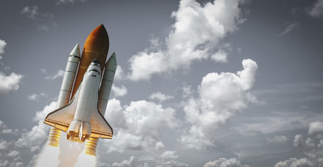 Naklejka premium Spaceship launch in clouds. The elements of this image furnished by NASA.