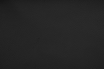 Obraz premium Deep dark black color luxury genuine cow leather texture background. Close up photography of sofa, chair, interior, auto seat cover