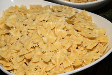 Fresh cooked simple no sauce pasta during brunch buffet