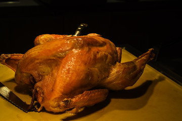 Christmas or Thanksgiving turkey on rustic wooden table