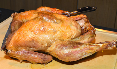 Christmas or Thanksgiving turkey on rustic wooden table