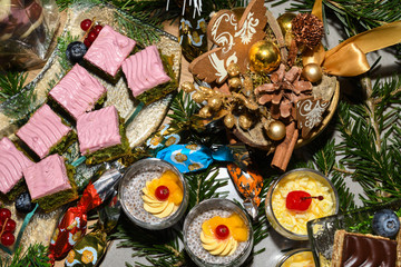 Various desserts in candy bar food buffet during hotel brunch, catering, cake pops, mousse, tarts