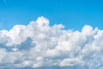 Naklejka na ściany i meble Blue sky background with white clouds, texture
