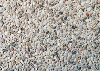 The texture of the wall of small stones.