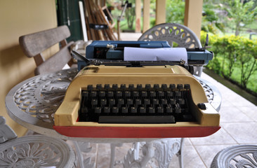 vintage typewriter with blank paper