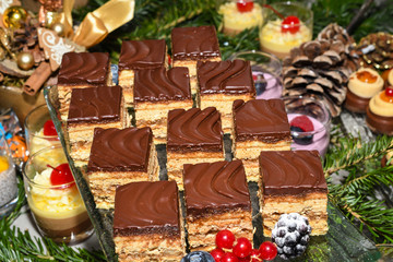Various desserts in candy bar food buffet during hotel brunch, catering, cake pops, mousse, tarts