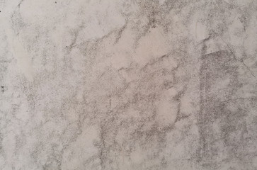 Texture of old gray concrete wall in scuffs for background.