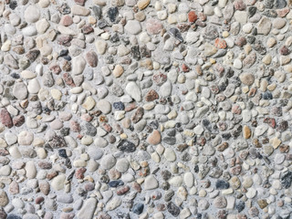 The texture of the wall of small stones.
