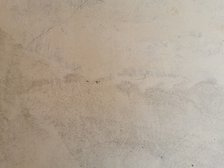 Texture of old gray concrete wall in scuffs for background.