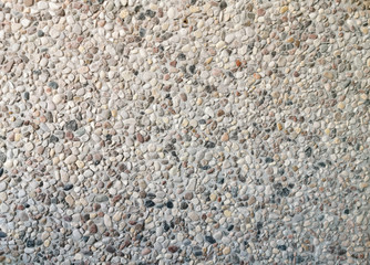 The texture of the wall of small stones.