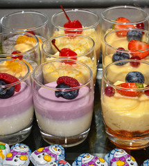 Various desserts in candy bar food buffet during hotel brunch, catering, cake pops, mousse, tarts