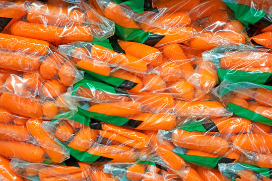 Fresh Baby Carrots In Plastic Bags In The Grocery Store