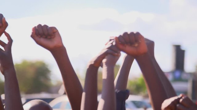 African people's fists in the air.