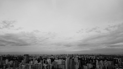 High Angle View Of Cityscape Against Cloudy Sky