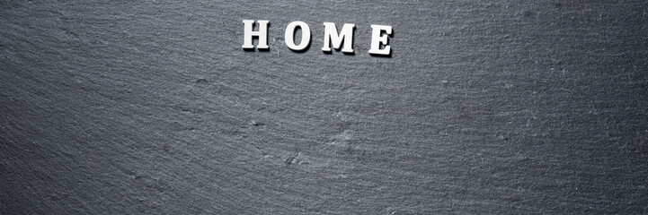 Home tag on black stone board