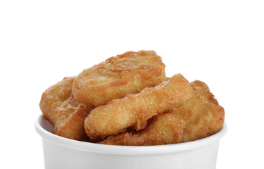 Bucket with tasty chicken nuggets isolated on white, closeup