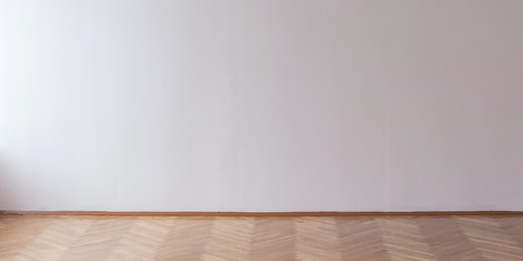 light through window illuminates large hall with empty concrete wall mock up