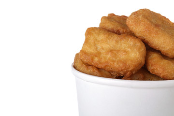 Bucket with tasty chicken nuggets isolated on white, closeup